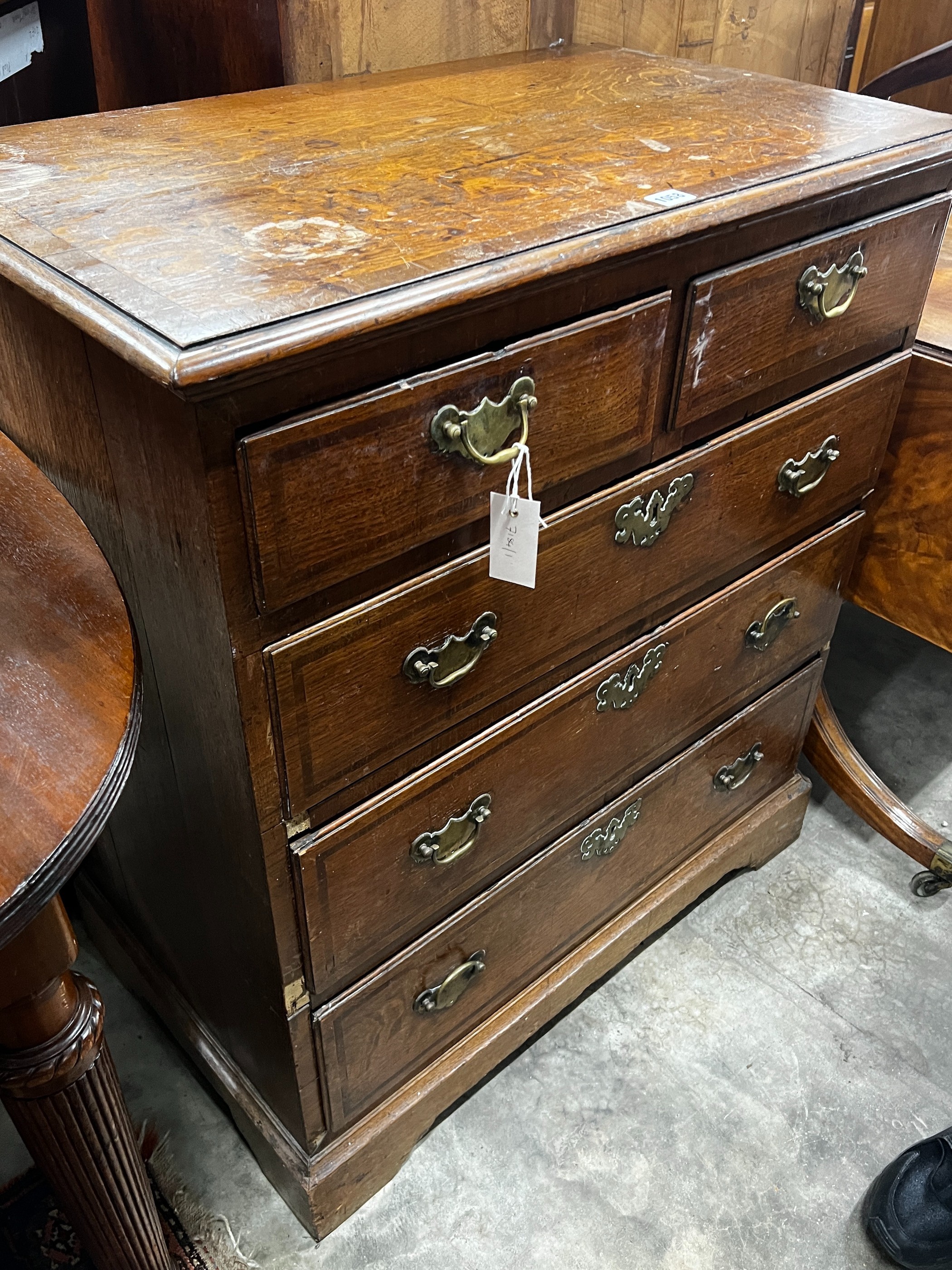 A George III mahogany banded oak chest of drawers, width 81cm, depth 49cm, height 92cm